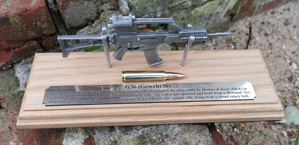 Pewter G36 on solid light oak wooden plinth. Presentation